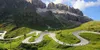 A winding mountain road with several motorcyclists. Anteprima dell’immagine prodotto