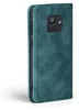 A teal flip cover case for a smartphone is shown from a side angle. Produktbild-Vorschau