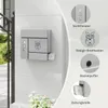 A gray mailbox with an owl design is mounted on a textured white wall, with inset circles highlighting features like a viewing window, the mailbox design, a lid buffer, and a newspaper roll. Produktbild-Vorschau