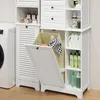 A white storage cabinet with a laundry basket and various cleaning products on shelves, next to a washing machine. Náhled obrázku produktu