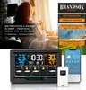 A woman in a bathrobe enjoying a morning drink, with a weather station and smartphone displaying weather information. Produktbild-Vorschau