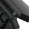 A close-up view of a black gaming keyboard, focusing on a USB port and some keys. Produktbild-Vorschau
