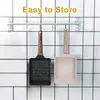 Two rectangular omelette pans hanging on a rack against a tiled wall. Náhľad obrázku produktu