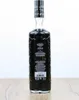 A bottle of Antica Sambuca Liquorice Flavour Liqueur on a wooden surface against a white background. Produktbild-Vorschau