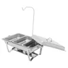 A stainless steel chafing dish with three compartments and a raised lid. Podgląd zdjęcia produktu
