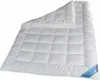 A white quilted duvet is shown laid out on a white background. Produktbild-Vorschau