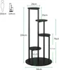 A diagram showing the dimensions of a plant stand, with a silhouette of a person for scale. Podgląd zdjęcia produktu