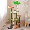 A cat tree with two cats in a room with a couch and a painting on the wall. Náhľad obrázku produktu