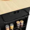 A close-up view of a kitchen island's countertop and storage area, featuring built-in power outlets and USB ports, along with glass jars containing food items on a shelf. Náhľad obrázku produktu