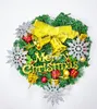 A Christmas wreath decorated with ornaments, bells, and a bow. Produktbild-Vorschau