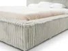 A close-up view of a bed with a light gray corduroy frame and a beige textured blanket. Produktbild-Vorschau