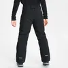 A person wearing black ski pants, viewed from the back. Produktbild-Vorschau