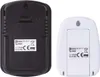 The back view of two EMOS digital thermometers, one black and one white, showing their battery compartments and labels. Podgląd zdjęcia produktu