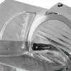 A close-up view of a food slicer's blade and guard. Produktbild-Vorschau