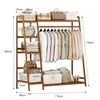 A wooden garment rack with clothes and storage boxes. Voir les images du produit