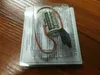 A lithium battery with wires and a connector, packaged in clear plastic on top of a white instruction sheet, resting on a wooden surface. Produktbild-Vorschau