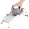 A hand is using a mandoline slicer to cut food. Náhled obrázku produktu