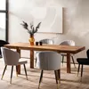 A dining table with chairs in a modern dining room setting. Produktbild-Vorschau