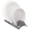 A white plate rack holding several white plates, isolated on a white background. Produktbild-Vorschau