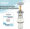 A product image showing a pop-up drain assembly with accompanying instruction booklet. Produktbild-Vorschau