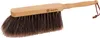 A dustpan brush with a wooden handle and dark bristles. Produktbild-Vorschau