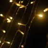 A close-up of string lights against a dark background. Produktbild-Vorschau