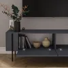 A modern TV cabinet with open shelves and drawers, decorated with books and vases, in a living room setting. Anteprima dell’immagine prodotto