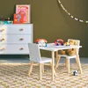 A child's play table and chairs set with toys on a rug in a room. Anteprima dell’immagine prodotto