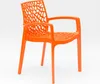 An orange plastic chair with an intricate, web-like design on the backrest and seat, presented against a plain white background. Anteprima dell’immagine prodotto