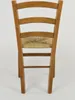 The back view of a wooden chair with a woven straw seat. Produktbild-Vorschau