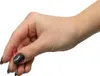 A hand holding a small red gel bead. Náhled obrázku produktu
