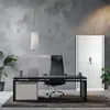 A modern office desk with a chair and storage cabinet. Anteprima dell’immagine prodotto