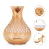 A wooden-patterned aroma diffuser with LED lights. Produktbild-Vorschau