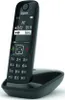 A black Gigaset AS690 analog/DECT cordless phone is shown resting on its charging base against a white background. Voir les images du produit