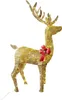 A golden illuminated reindeer decoration with a red bow around its neck, set against a white background. Náhled obrázku produktu