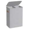 A light gray laundry basket with two compartments and a lid, shown from a slightly elevated front-left angle against a white background. Produktbild-Vorschau