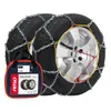 A pair of snow chains on car tires, with a storage bag in the foreground. Podgląd zdjęcia produktu