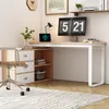A modern home office setup with a desk, computer, and chair. Voir les images du produit