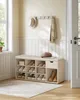 A shoe bench with storage in a hallway next to a window and a door. Produktbild-Vorschau