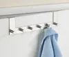 A metal over-the-door hook rack with a blue towel hanging from one of the hooks. Produktbild-Vorschau