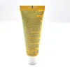 A close-up of a yellow tube of sunscreen with text printed on it. Produktbild-Vorschau