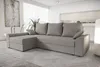 A light gray sectional sofa is shown in a modern living room setting. Náhled obrázku produktu