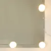 A close-up view of a mirror with LED lights around the edge. Produktbild-Vorschau