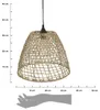 A woven pendant light shade with a light bulb inside, shown with a ruler and hand silhouette for scale. Náhled obrázku produktu