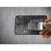 A hand is shown inserting a Samsung battery into a disassembled smartphone. Produktbild-Vorschau