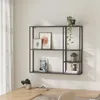 A modern wall shelf mounted above a wooden desk, decorated with plants and framed pictures. Náhled obrázku produktu