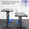 Two adjustable height desks shown in a room with a white wall and gray carpet. Anteprima dell’immagine prodotto