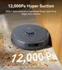 A robot vacuum cleaner is shown cleaning up debris on a floor next to a wooden cabinet. Text highlights its suction power. Anteprima dell’immagine prodotto