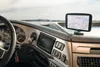 The interior of a truck cabin, showing the dashboard with a GPS device mounted. Produktbild-Vorschau