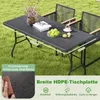 A folding garden table set up on a lawn with two chairs. Anteprima dell’immagine prodotto